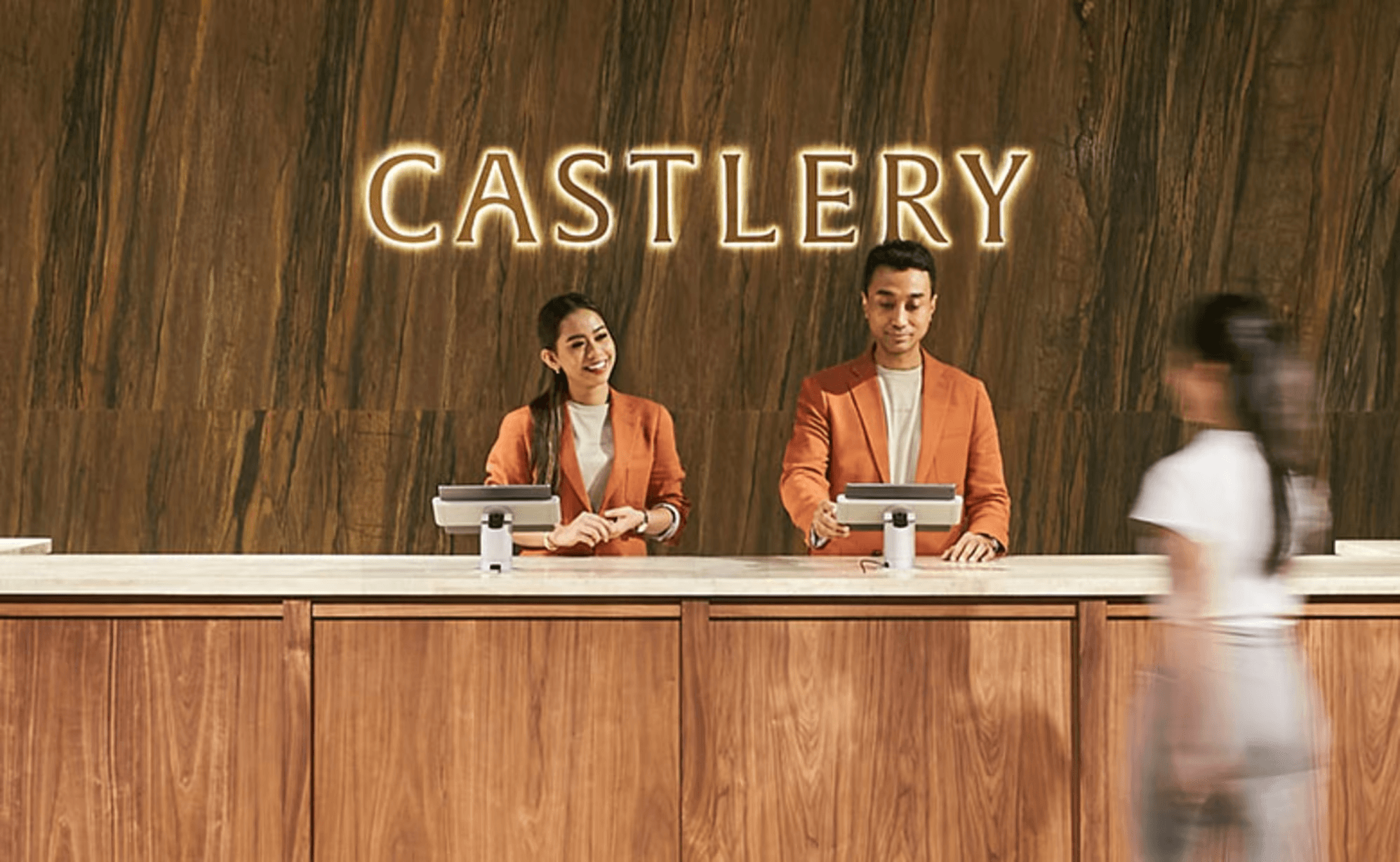 Castlery showroom reception with illuminated Castlery signage